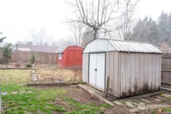 Back yard with storage sheds