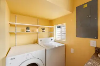 Laundry space with accessible storage space.