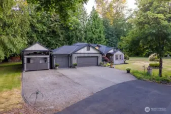 Seculded home nestled on 1.3 acres, extra building for your RV