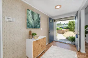 Step through grand double doors into a welcoming entryway that sets the tone for the rest of the home