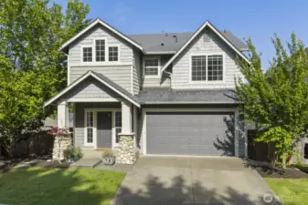 Low-maintenance turf front yard with space for natural trees and plants to create shade and enhance curb appeal.