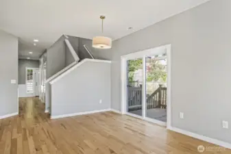 Newly added sliding door opens to a spacious deck with direct access to the fenced turf backyard and a charming wild fruit orchard featuring cherry trees, apples, pears, and more.