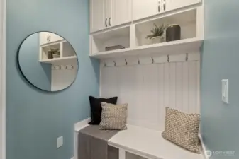 Beautiful mudroom designed for winding down and staying organized right after entering from the garage.(staged pic)