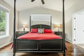 Primary bedroom with vaulted ceilings