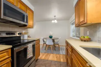 The kitchen looks out to the dining room.