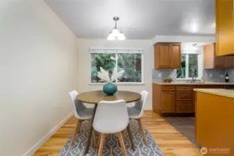 looking from the living room to the dining and kitchen area.