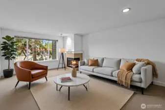 Enjoy the spacious living room with abundant natural light and wood burning fireplace. The owner has installed new carpet and professionally repainted the interior walls.  Nothing to do but move in.