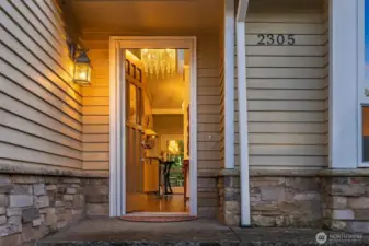 The warm, inviting warm wood entryway is the introduction to this meticulously maintained home.