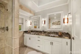 The primary bath is highlighted by wonderful surround tile floors and shower detail plus rich granite countertops and freshly painted cabinetry.