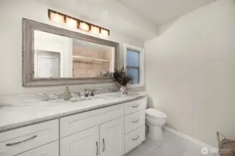 The full bath upstairs is shared by the two bedrooms and has so much room and cabinetry.