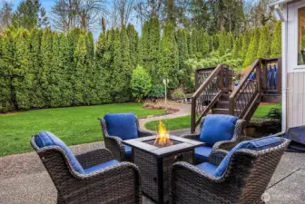 The back landscape offers a wonderful patio space, just off the kitchen deck.