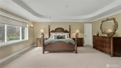 Spacious primary with 5-piece bathroom, and two closets