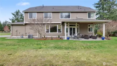 Spacious backyard with covered patio
