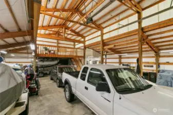 Parking for 6+ Cars / RV! Equipped w/ a Pellet Stove, Loft Storage,Exterior Covered Wood Storage, & Low Maint Gutter Guards!