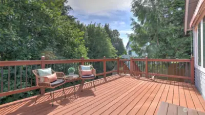 Entertainment deck overlooks the yard and green space perfect for relaxation and summer BBQ's.