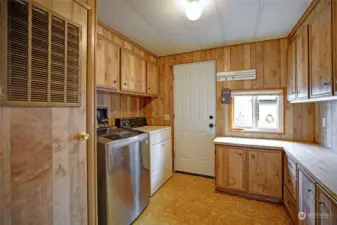 Laundry room with door to private back deck.