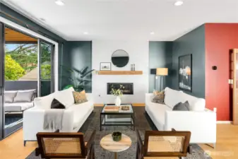 Comfortable living room complete with custom mantle-piece and convenient gas fireplace.