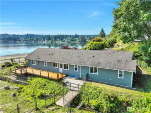 View of deck.  The home includes a storage shed