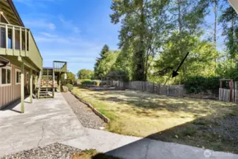 The back gate opens to Daria Lane providing access to the detached garage.