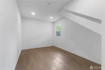 First floor bedroom in the additional living space on right side of garage building.