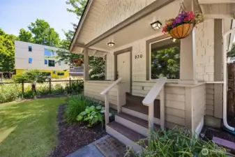 Welcome home! Covered front porch with composite decking invites you in with style and durability. (The front yard was green at the time of our photos)