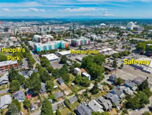 So close to everything. Live here and ditch the car! Major grocery store just steps away! It's the large parking lot and roof to the right of the photo.