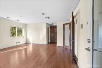 Upper-level flex space with hardwood floors, skylights, and a half bath - ideal for an office, studio, or creative retreat