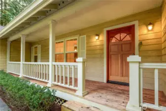 Welcoming entry surrounded by mature landscaping