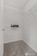 Spacious walk in closet in primary