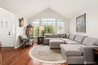 Relax in the light-filled family room, where expansive windows invite in abundant natural light.