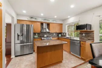 Create your favorite meals in the eat-in kitchen, complete with stainless steel appliances, a custom backsplash, and sleek countertops