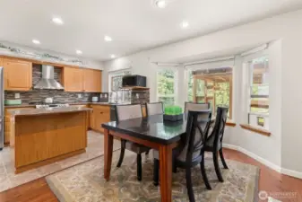 An open-concept kitchen, dining, and living area creates a seamless flow. Perfectly designed for both effortless everyday living and elevated entertaining