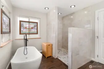Unwind after a long day in your soaking tub or rejuvenate in the sleek, custom-designed shower