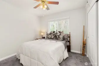 Second bedroom comfortably accommodates a queen-sized bed, offering both space and versatility.
