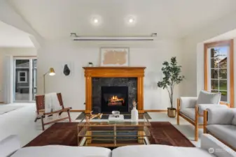 Living room with cozy gas fireplace & bay window