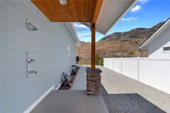Outdoor shower and side yard with ample room for boat and trailer storage.