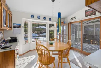 Eating nook off of kitchen and access to the expansive AZEK plank deck. Built in deck for storage.