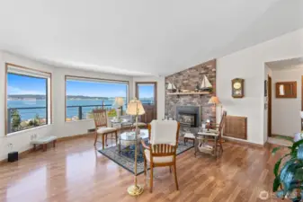 Living room with gorgeous views. Gas fireplace with brick surround.