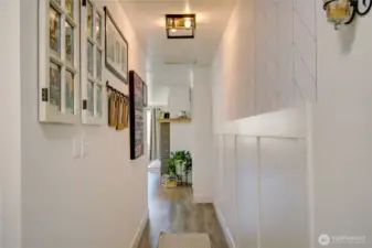 Hallway leading to additional bonus room and bedrooms.