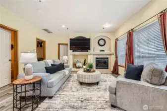 The family room is perfect for watching television, or if you prefer, reading a good book with ambiance of the gas fireplace. A "powder room" is very convenient and just to the left.