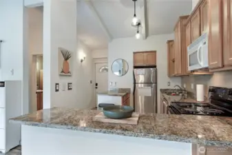 Loads of counterspace and storage in this beautiful kitchen with newer dishwasher.