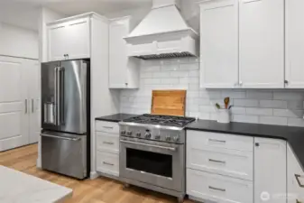 High end appliances with a gas range.