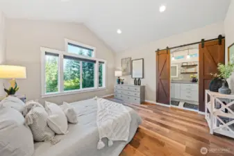 spacious and beautiful primary bedroom with spa like on-suite