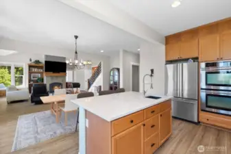 The large island with prep sink is a great place to create your culinary delights, and you will love the double ovens when preparing those large Holiday meals.