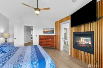 The beautiful primary suite with built in gas fireplace and unique access wall. I think you be impressed.