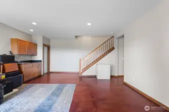 Another view of the family room with sink area. The door on the left goes to the unheated wine room. (Not shown)
