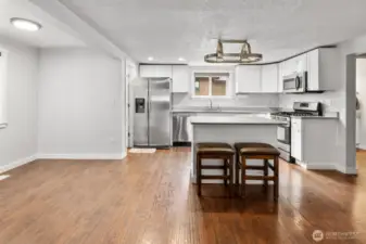 Eat in nook and a walk in pantry to the left of the refrigerator.