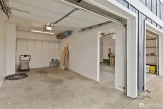 Garage bay 2 has access to bay 1 and MORE storage under home.