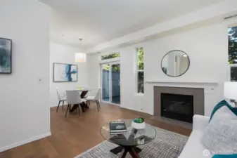 Living room flows easily into the dining room and back patio.