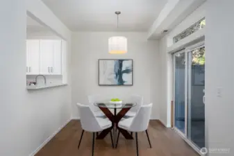 Dining room has a pleasant view of the patio and backyard.